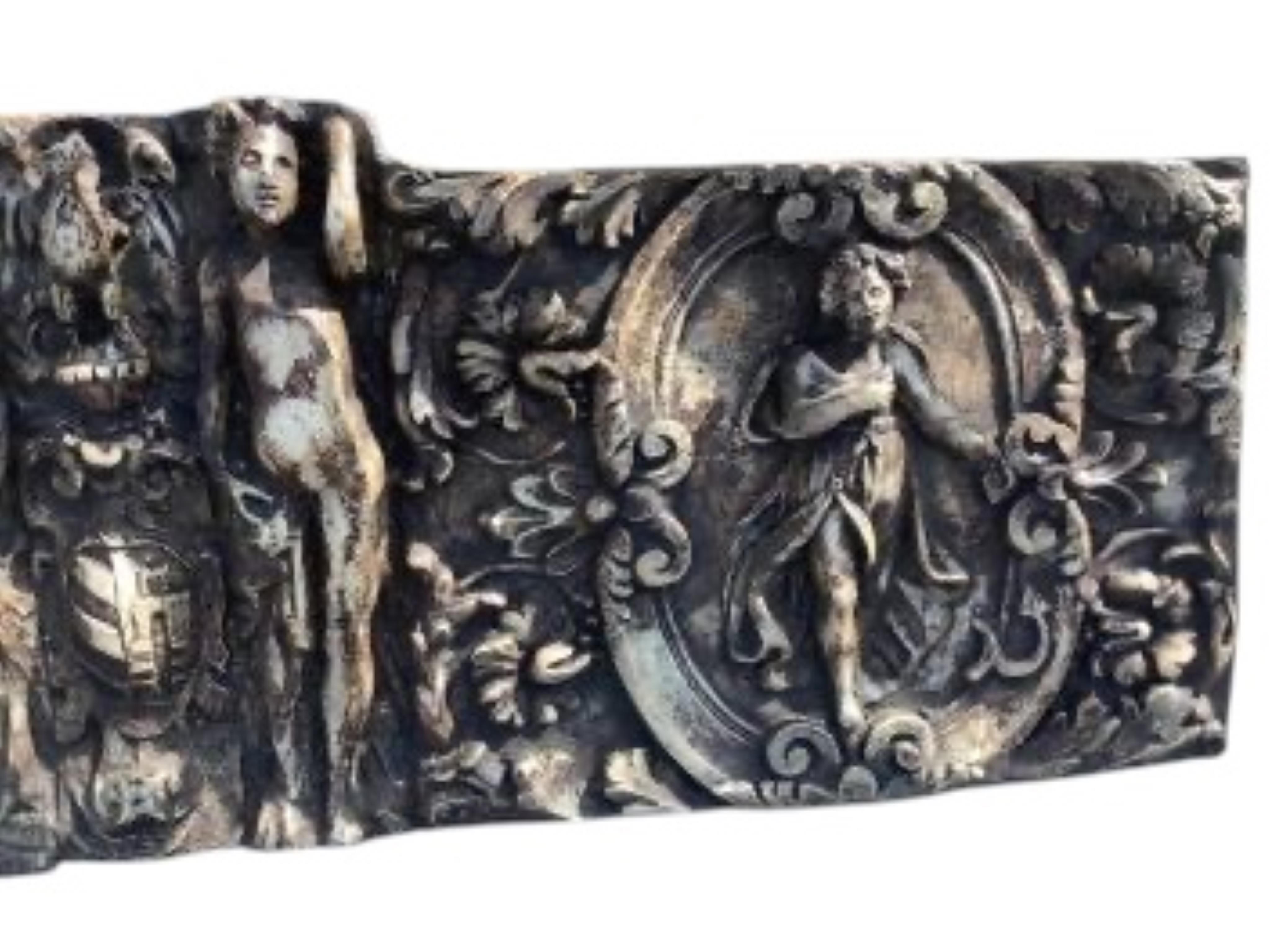 A cast plaster classical wall plaque, width 122cm, height 37cm